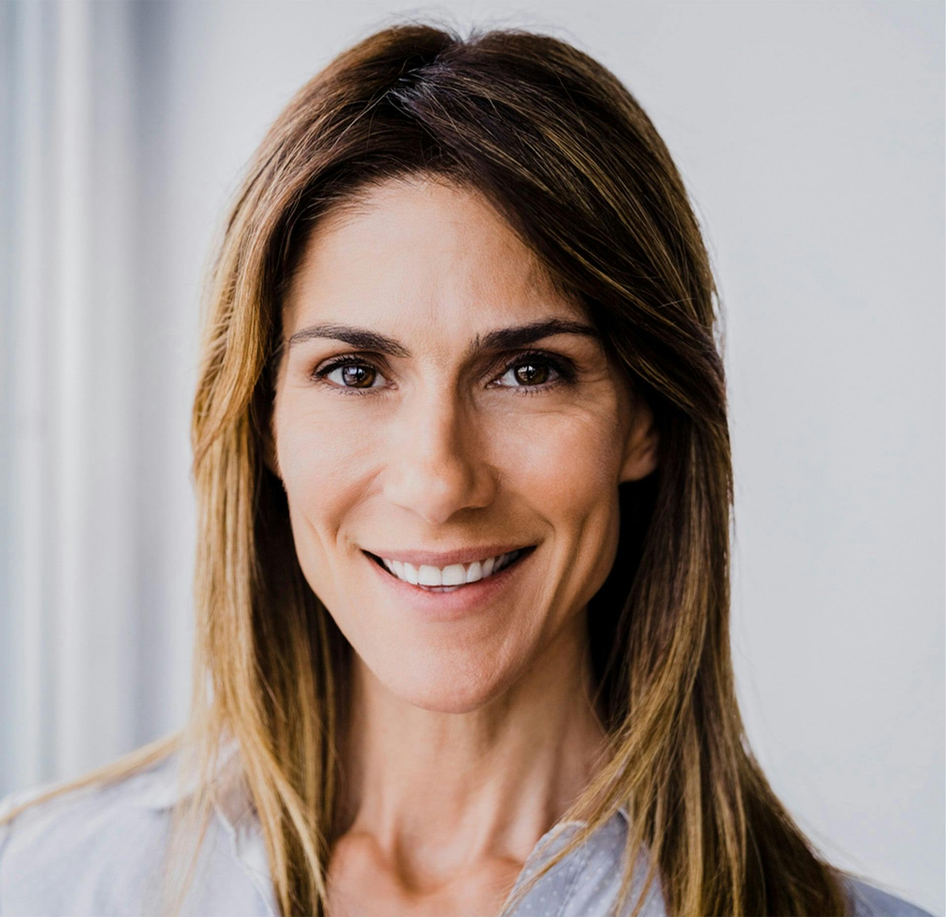 woman with brown hair smiling
