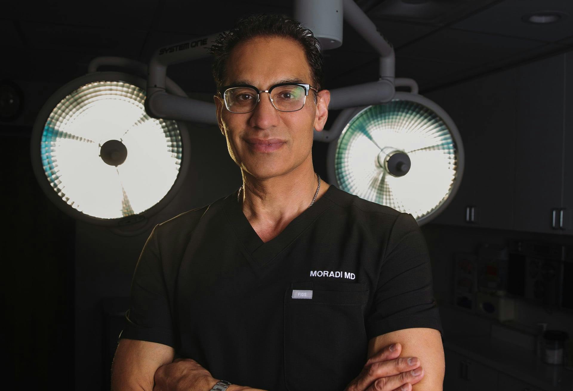 Dr. Moradi with lights behind him