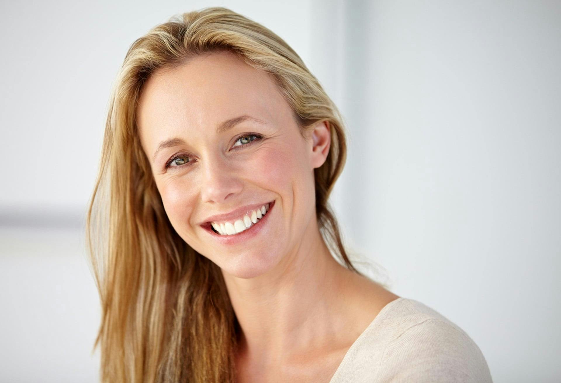 woman with blonde hair smiling