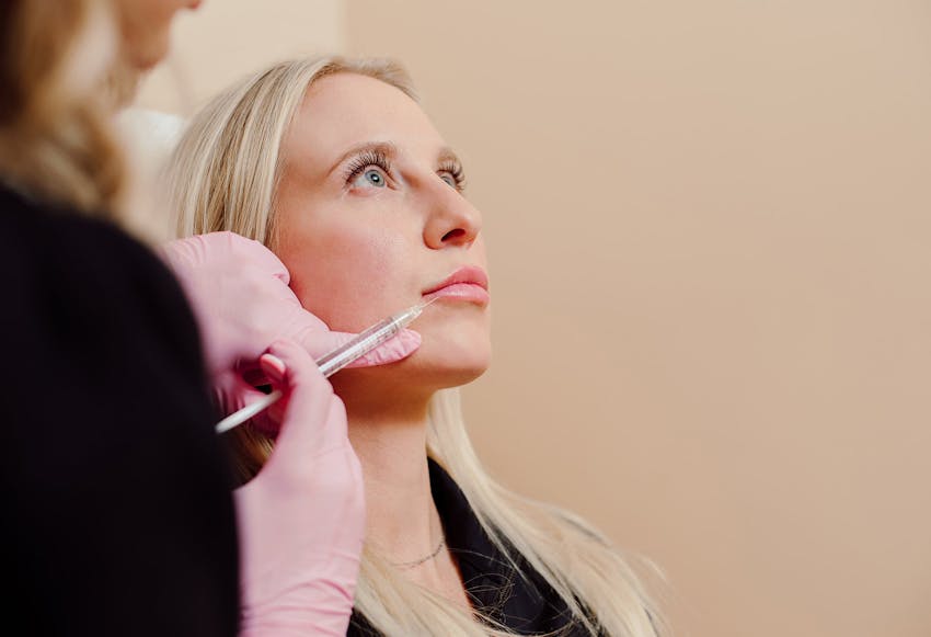 woman being injected in her lips