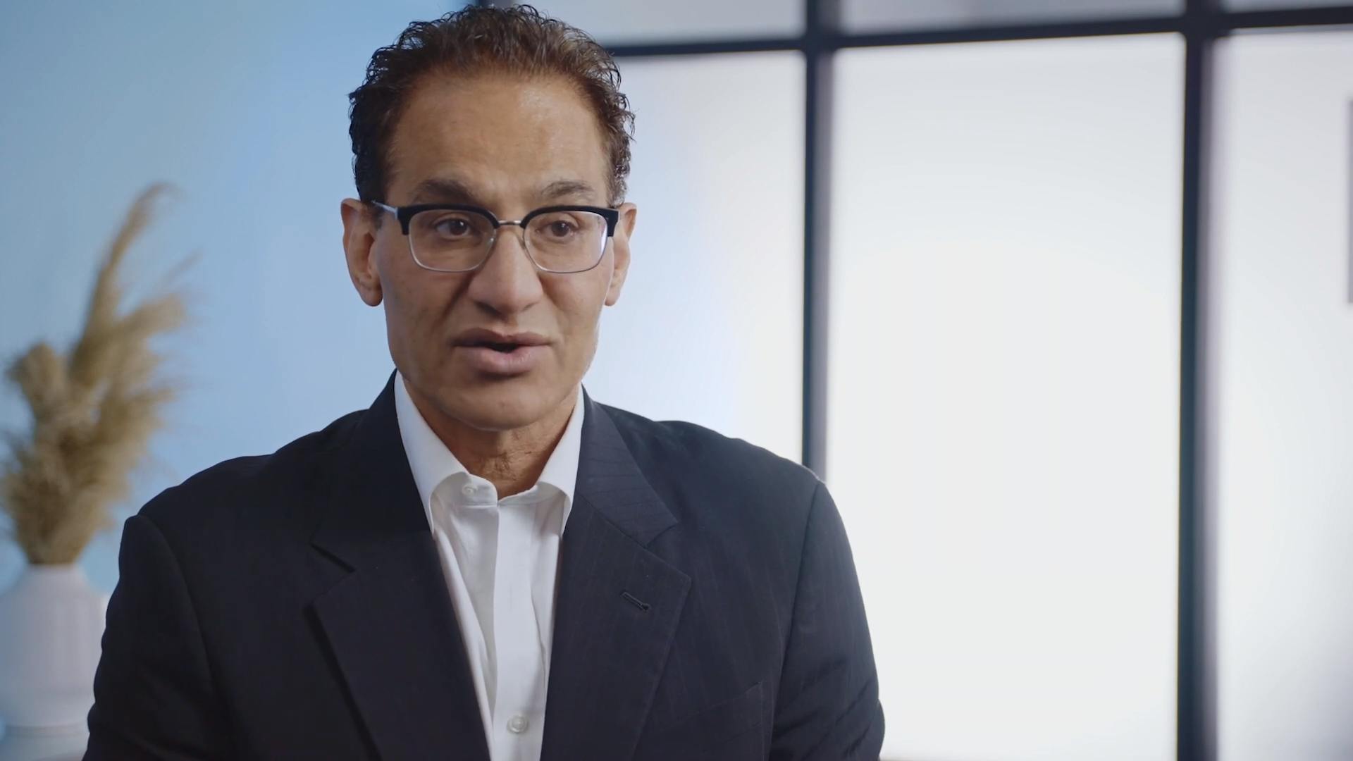 Dr. Moradi in a suit