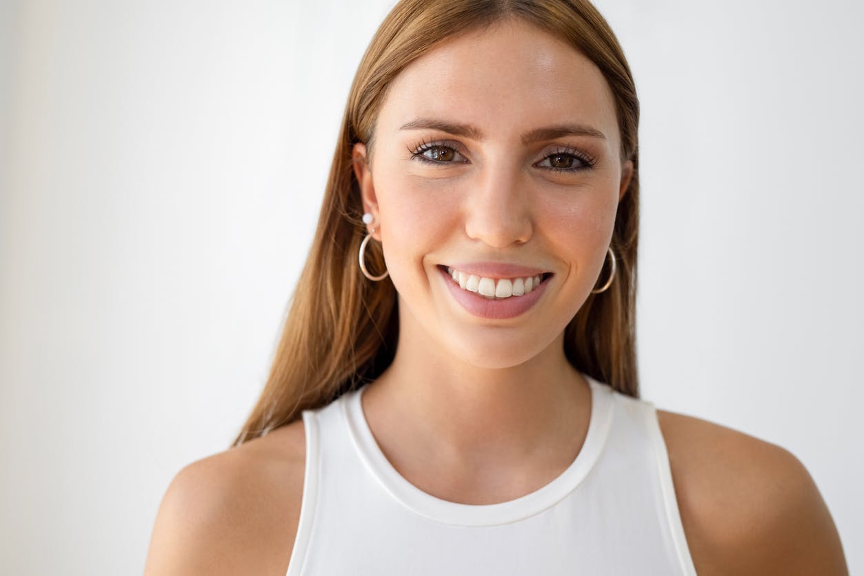 woman wearing a white tank top
