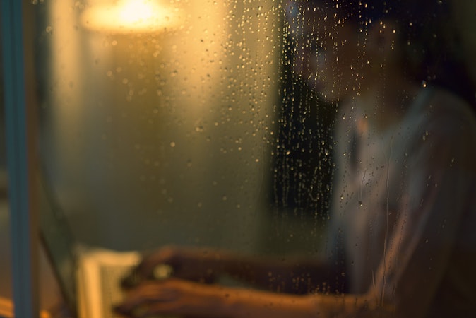woman on laptop during a storm with backup batteries