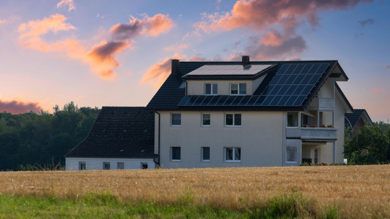 home with solar panels and home backup battery