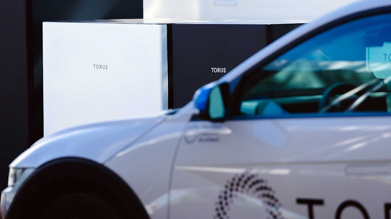 Torus ev parked in front of torus energy solutions.