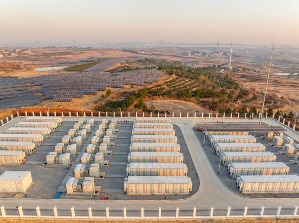 Aerial shot of warm commercial energy storage during the sunrise.