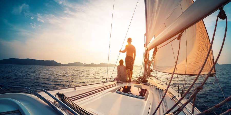 couple sailing on a boat in new zealand