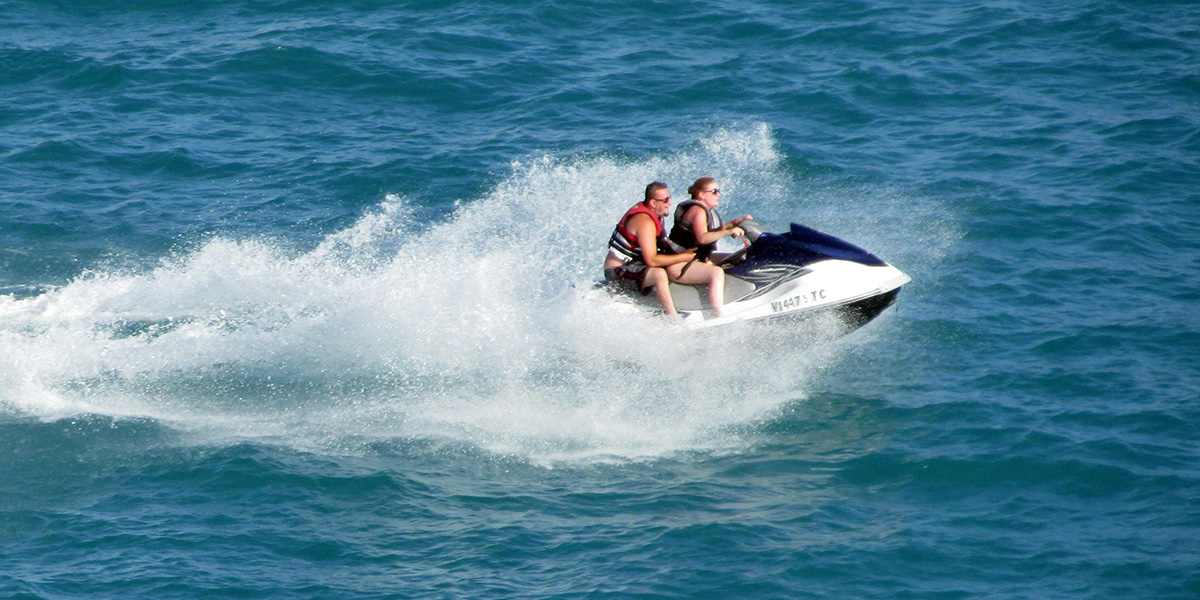 couple riding a jet ski in new zealand