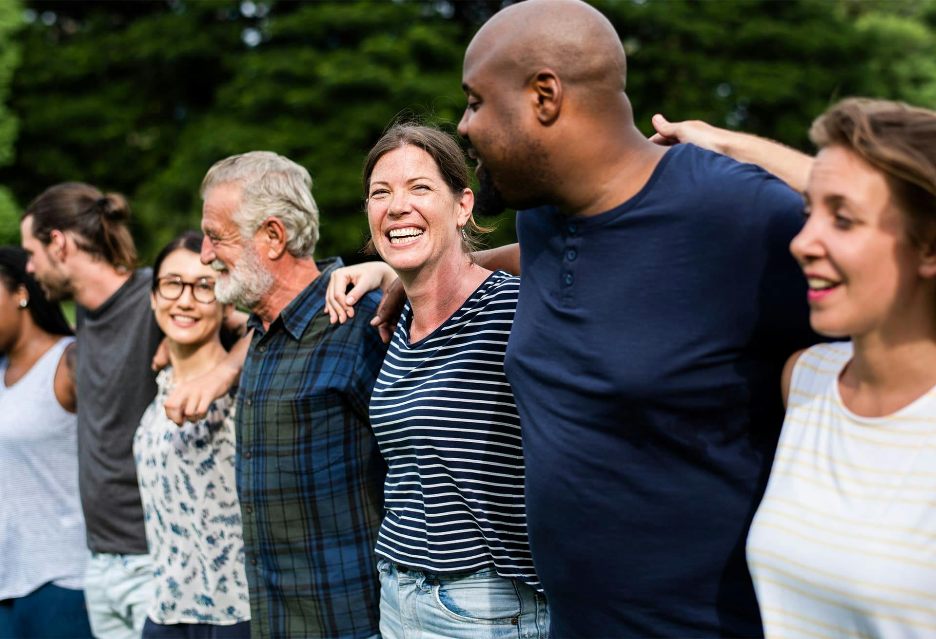 Group of People Standing Arm and Arm