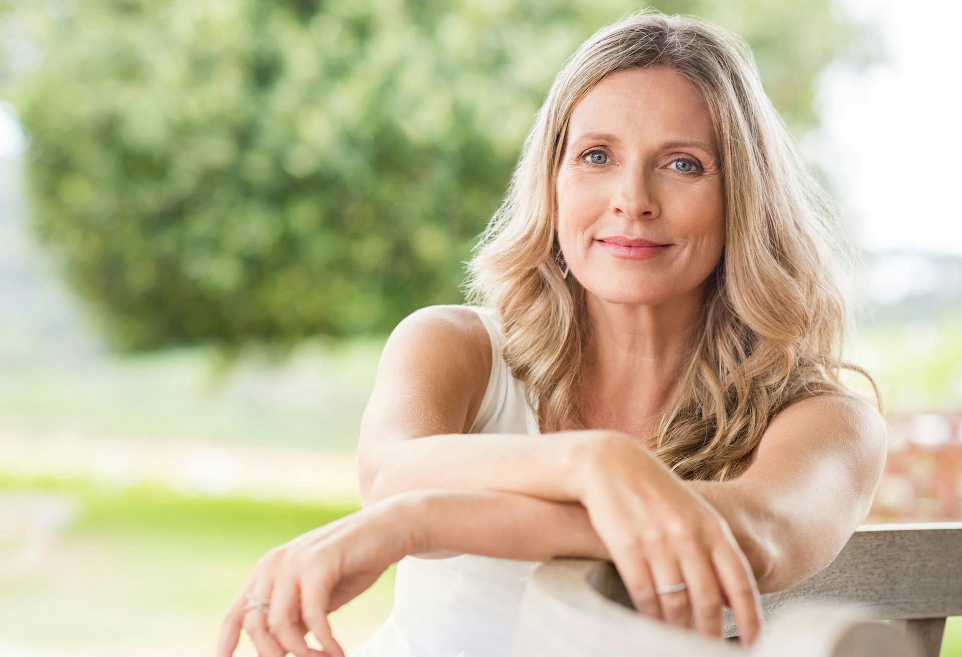 Blonde Woman Sitting Outside