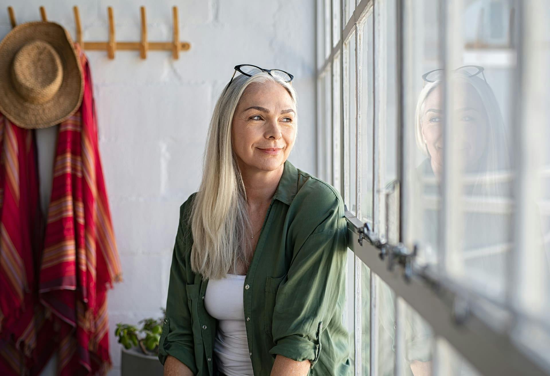 Woman Looking Out of the Window