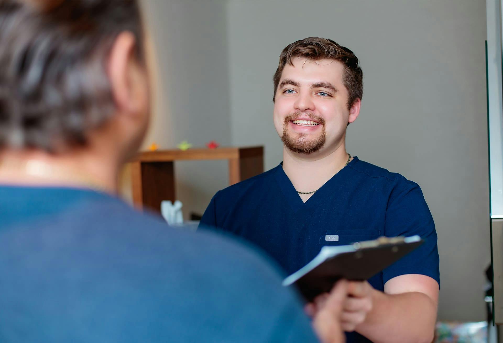 Medical Professional Smiling at Patient
