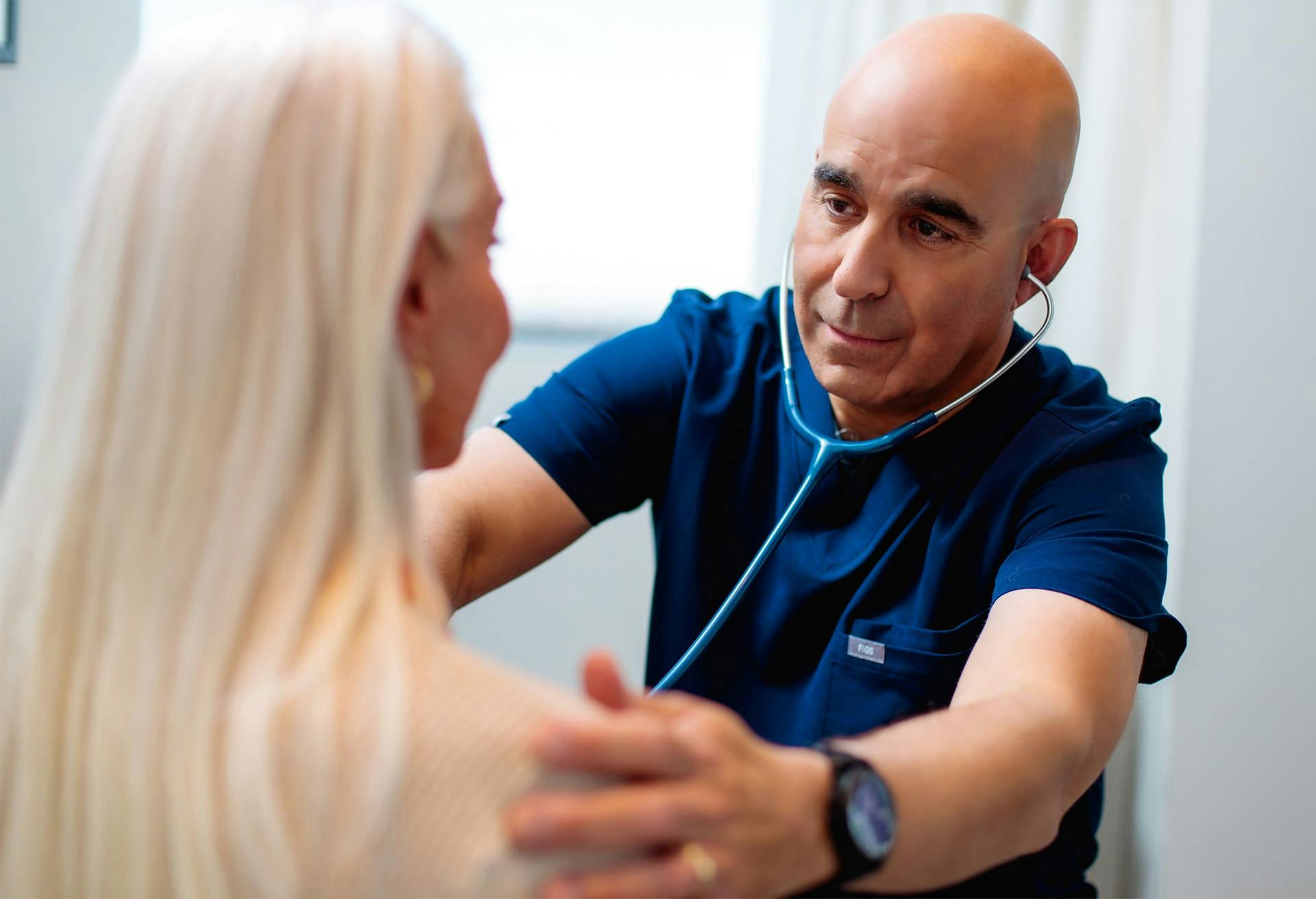 Doctor Checking Patient's Heartbeat