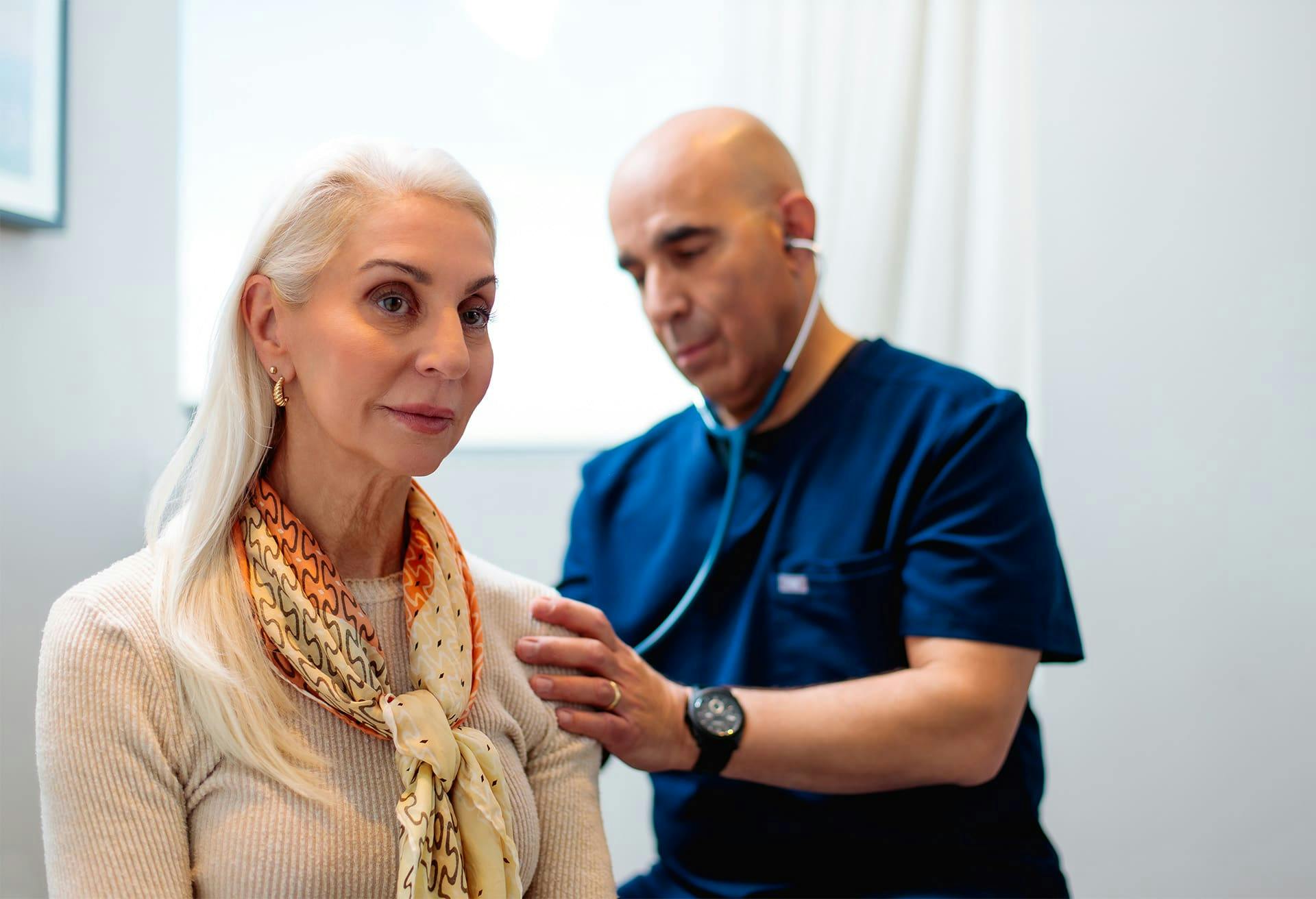 Doctor Checking Patient's Heartbeat