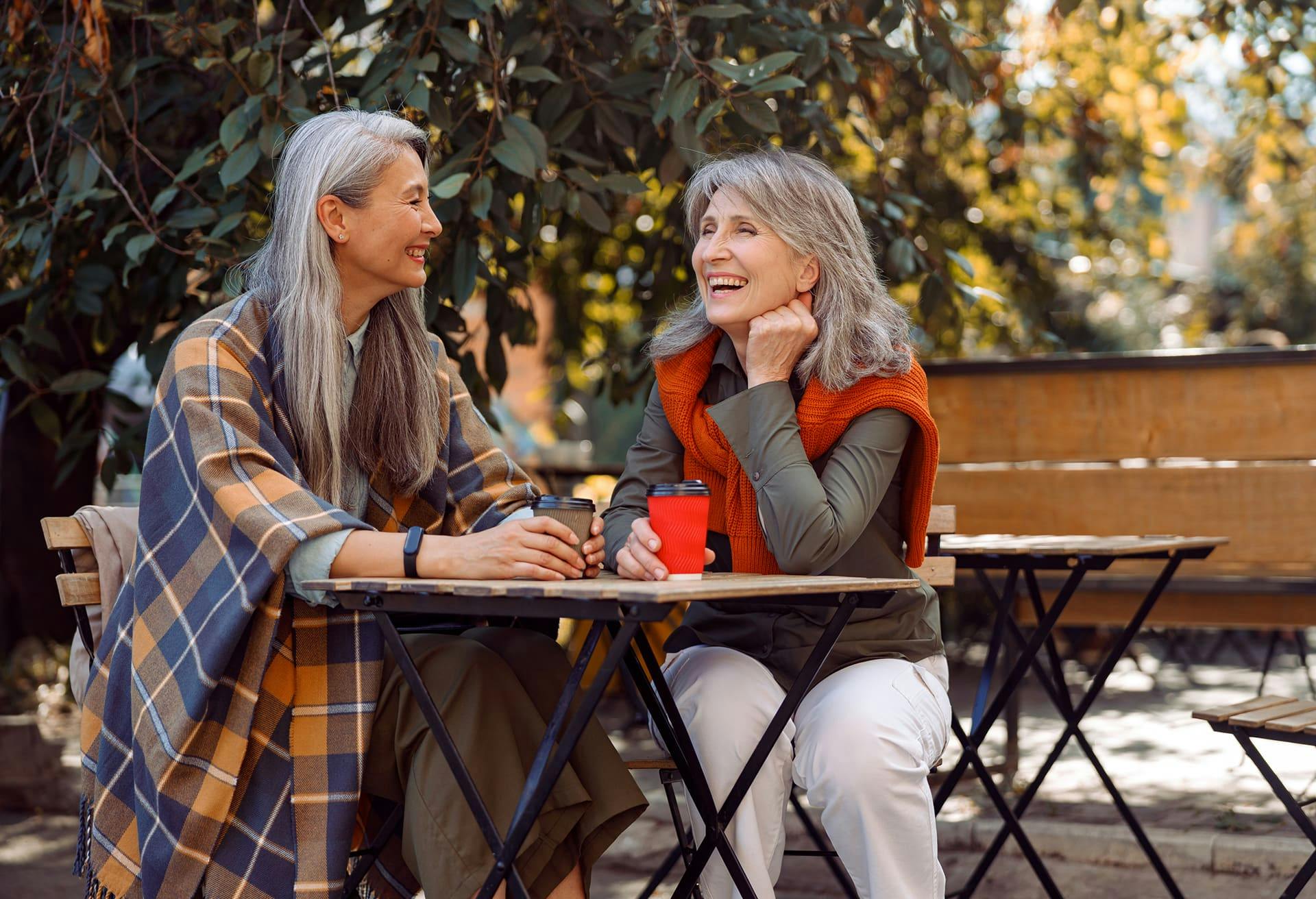 Two Women Chatting Over Coffee