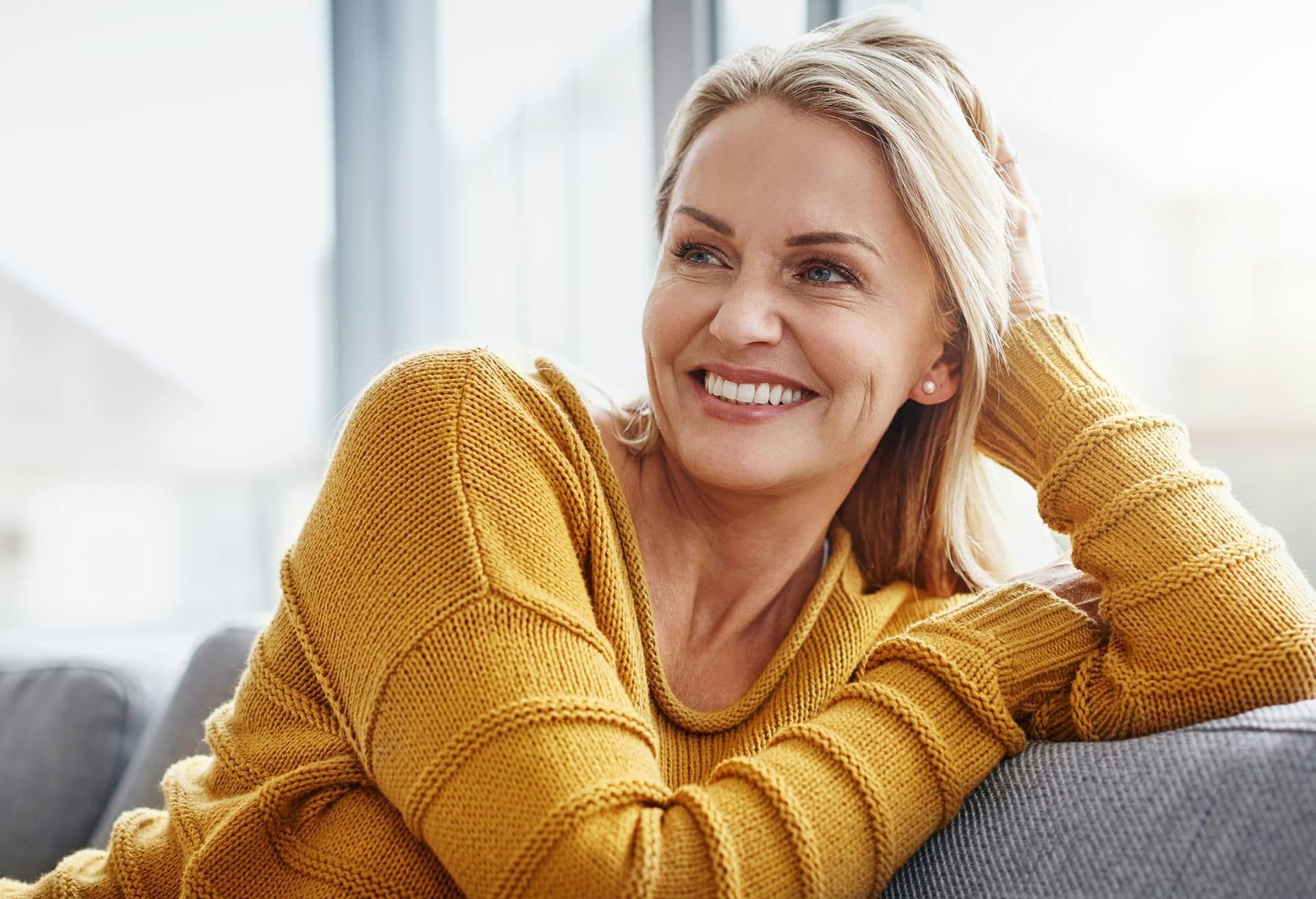 Woman Sitting with Yellow Sweater