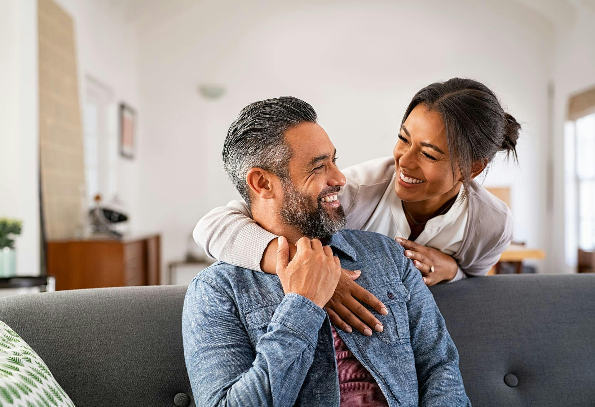 Couple Hugging and Smiling at Eachother