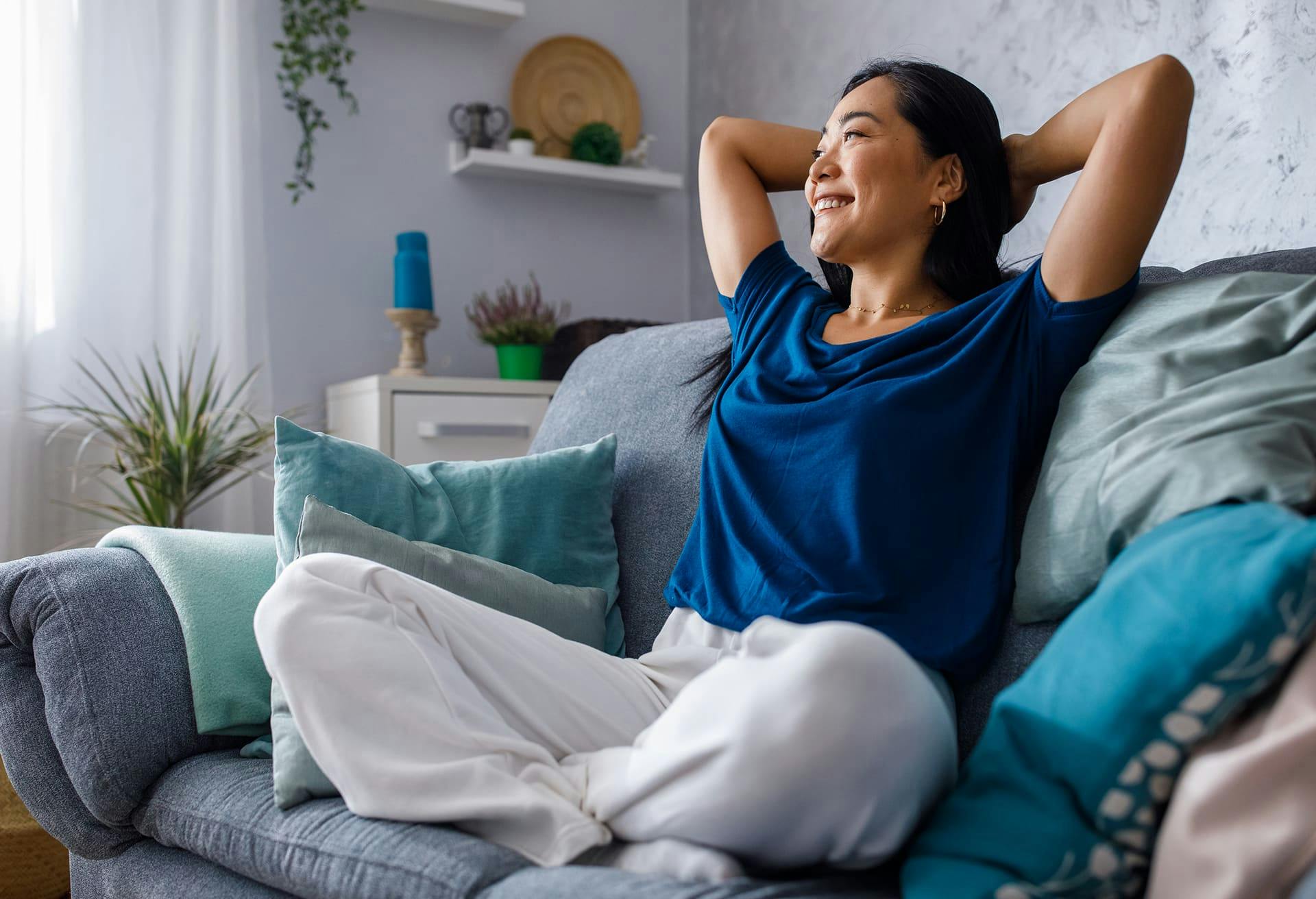 Woman Stretching on Her Couch