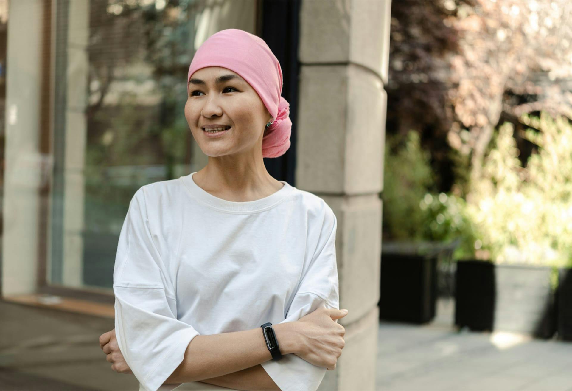 Woman with White T-shirt and Pink Head Cover