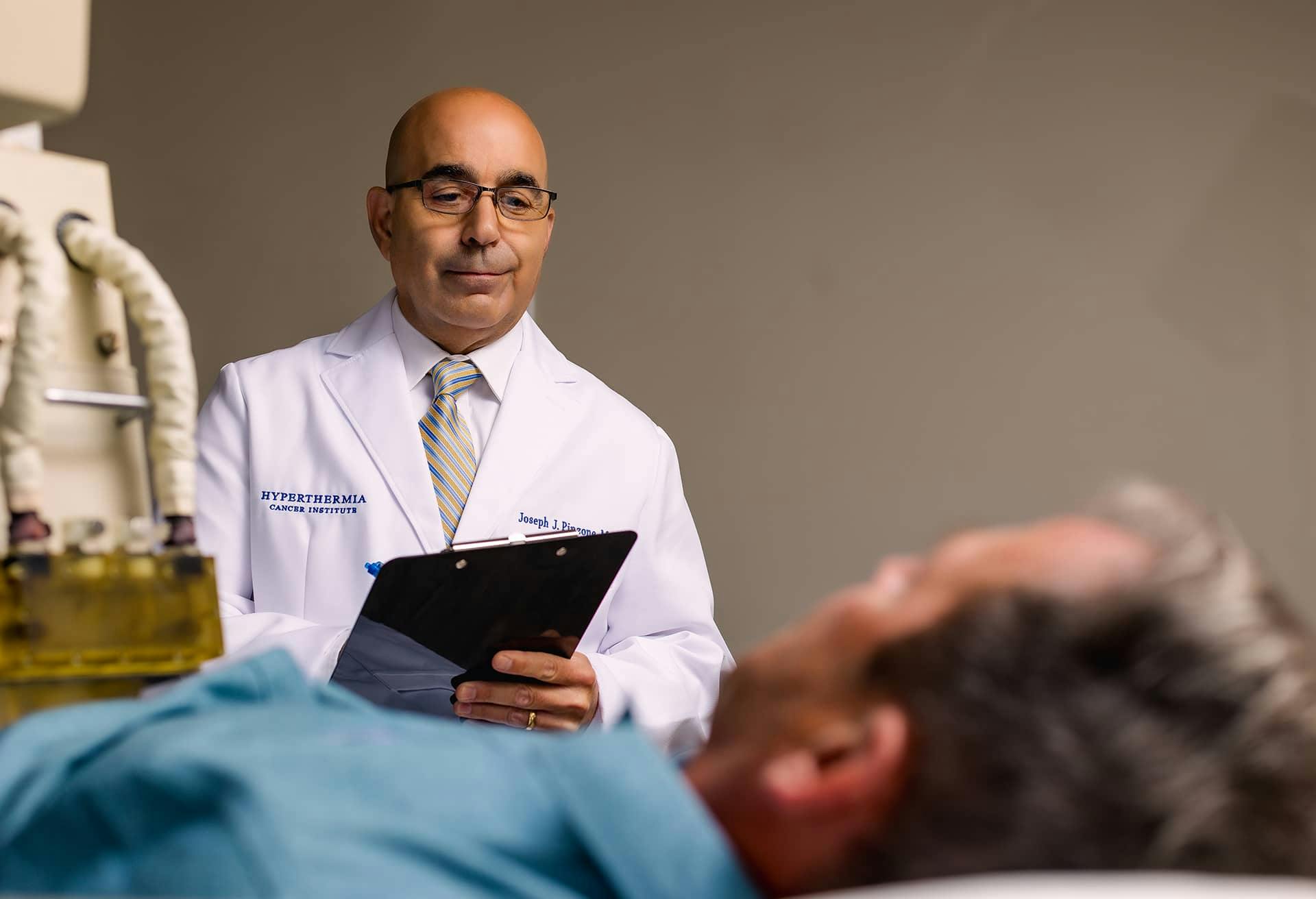 Dr. Pinzone with a male patient