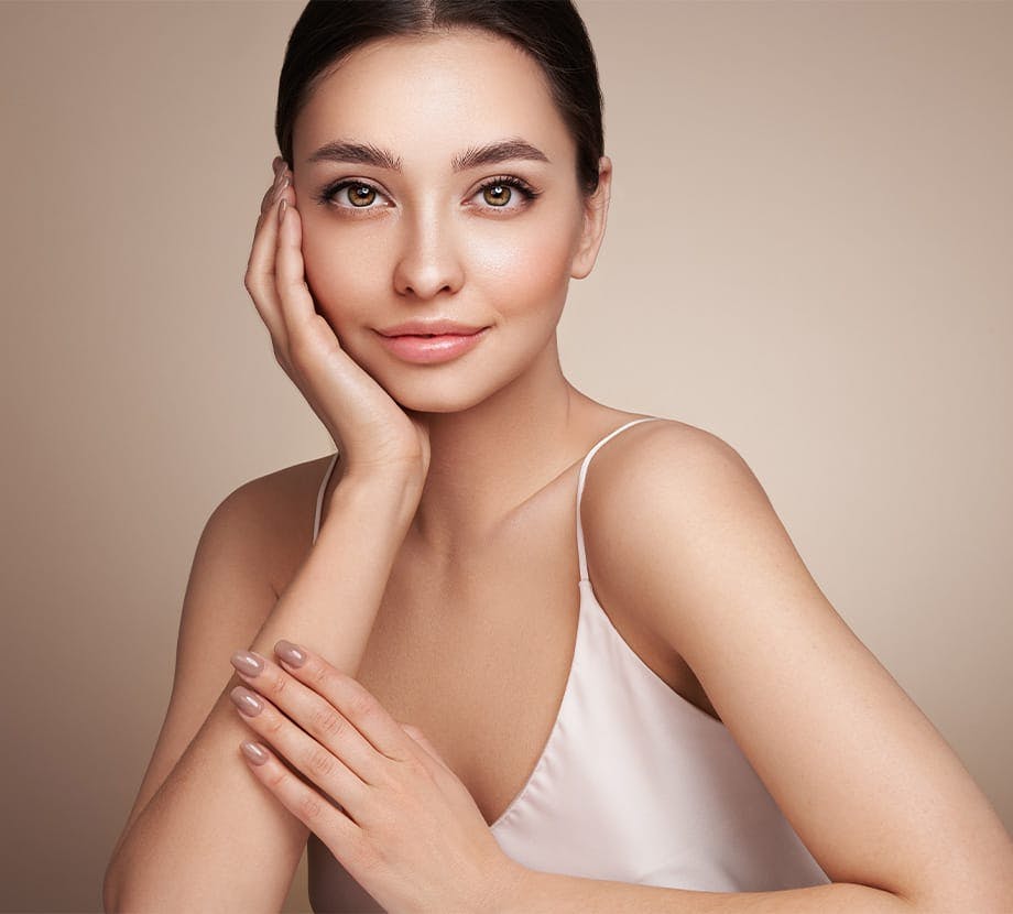 woman with her hand on her face