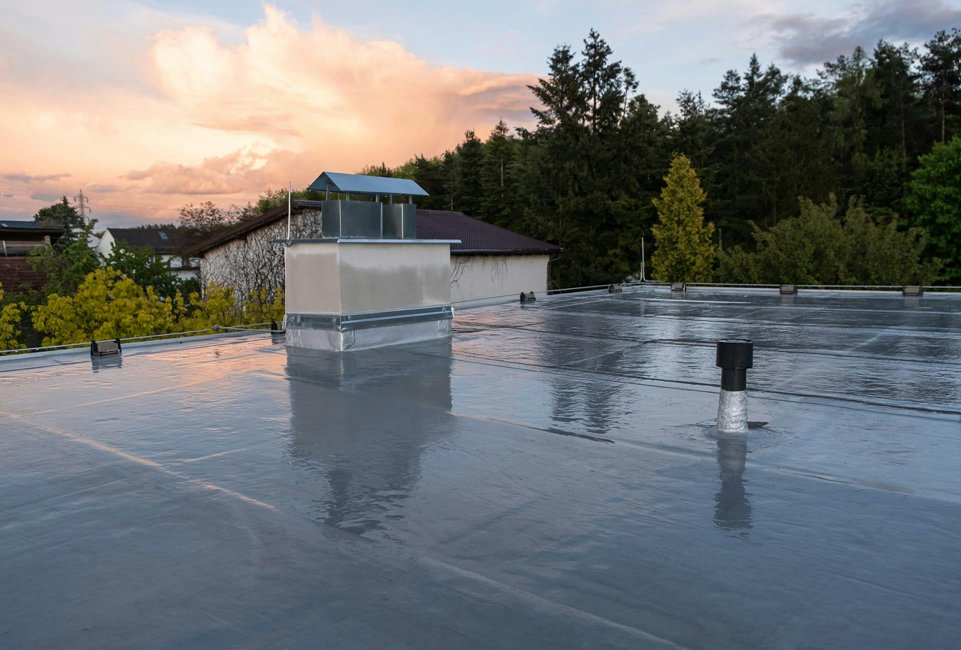 there is a roof with a chimney on it and a roof venter on the roof