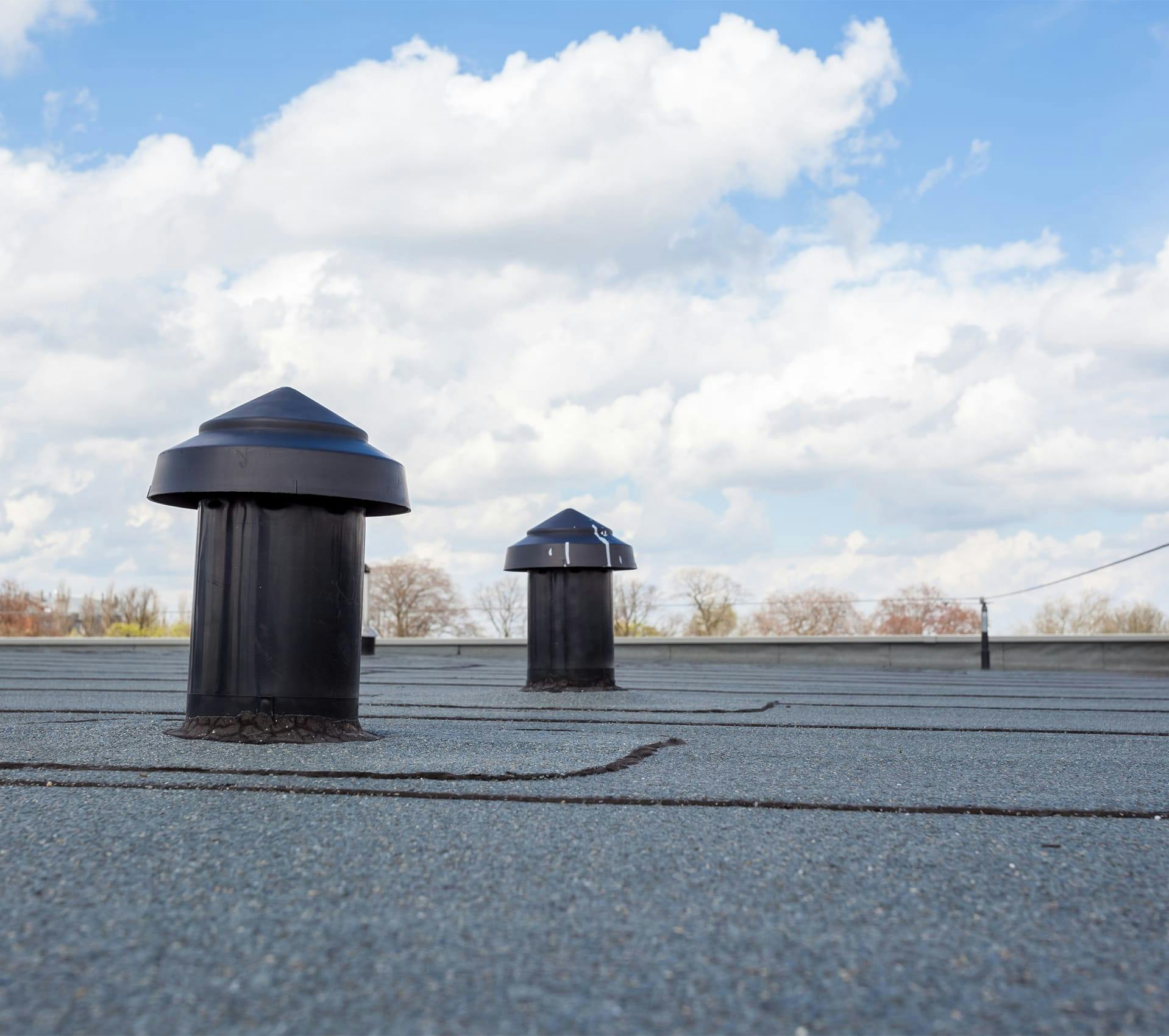 two black vents on a roof
