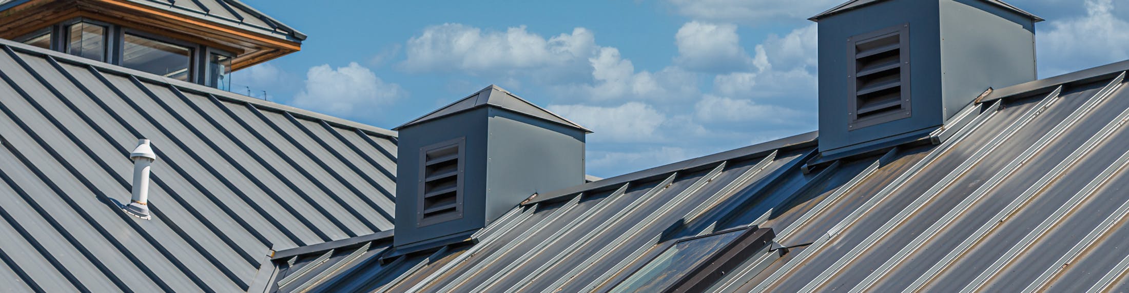 there are two chimneys on the roof of a building