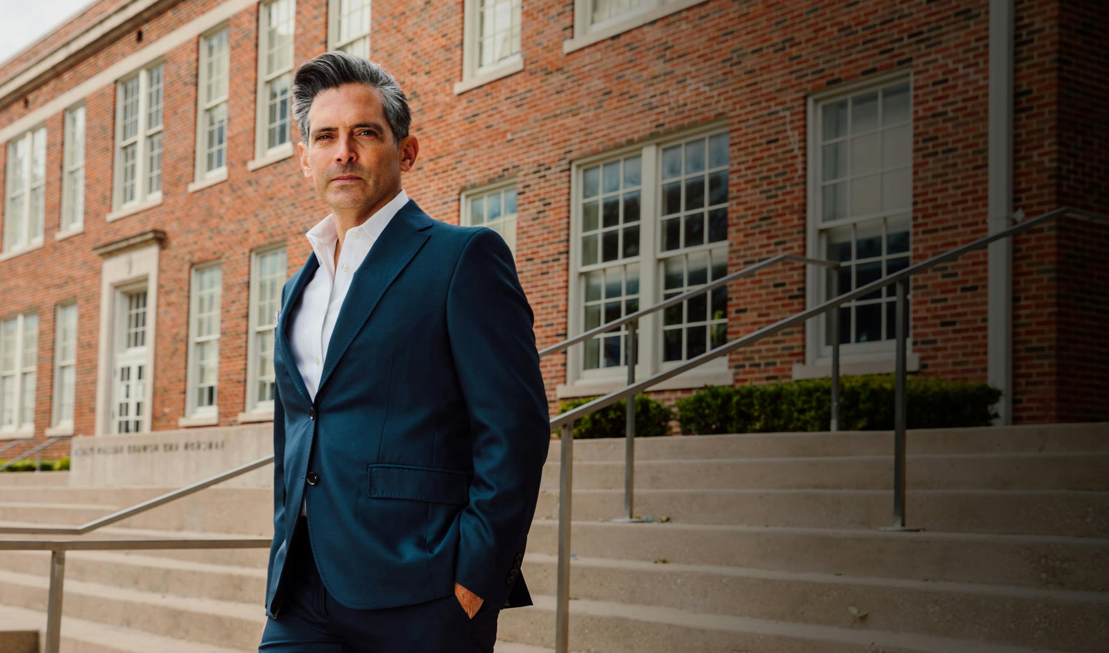 Man in a suit standing outside