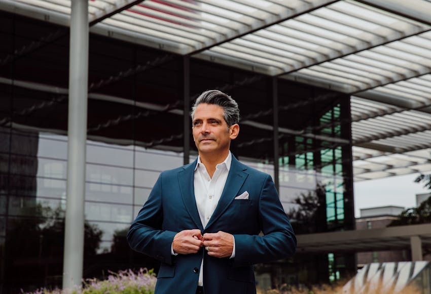 Doctor Meade standing in front of a building