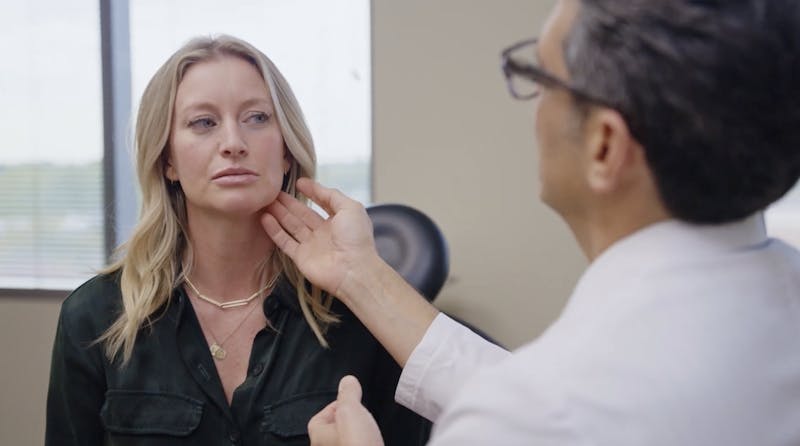 Dr. Ricardo A. Meade examining patient