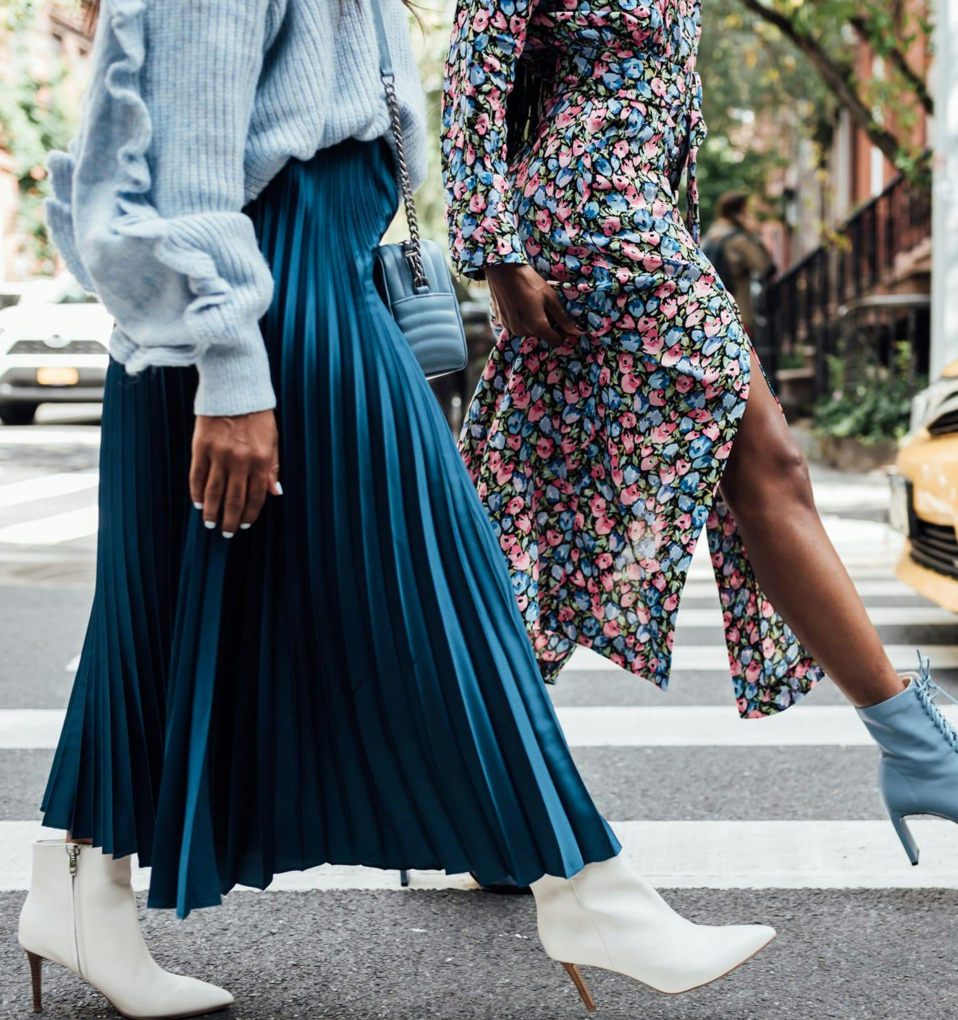 2 Women walking across the street