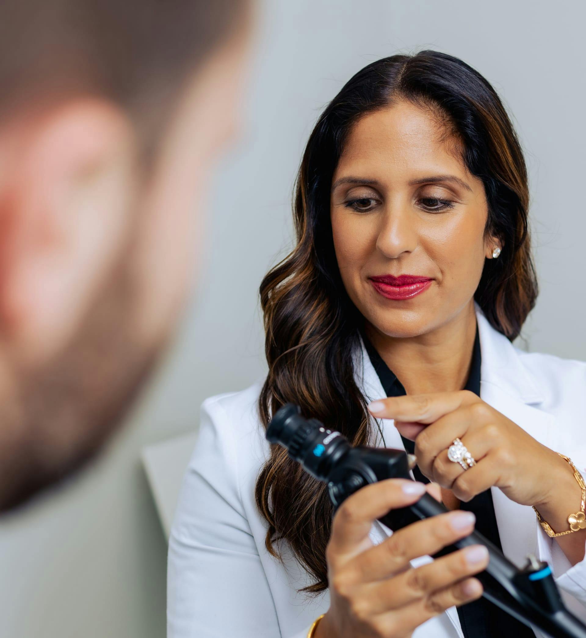 Dr. Sonia Bahlani showing patient device