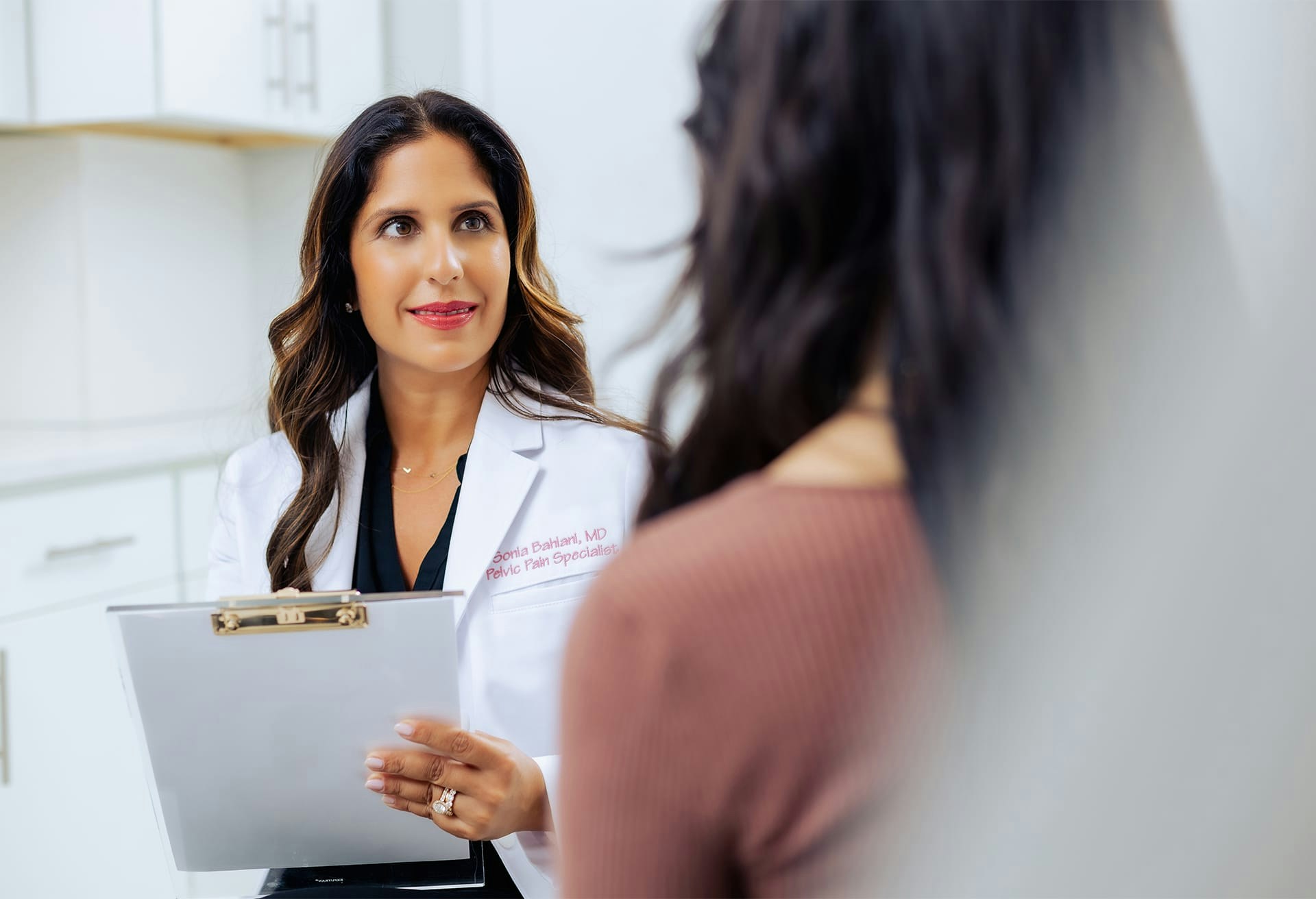 Dr. Sonia Bahlani speaking to patient