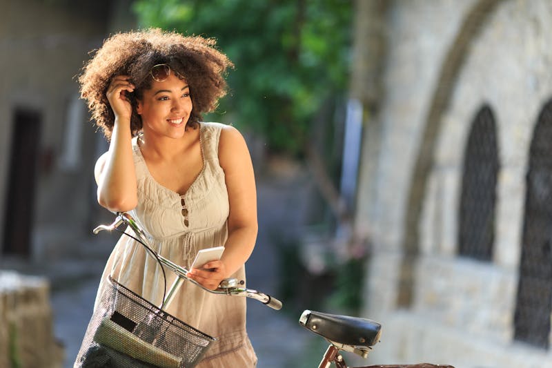 Woman outside with a bike