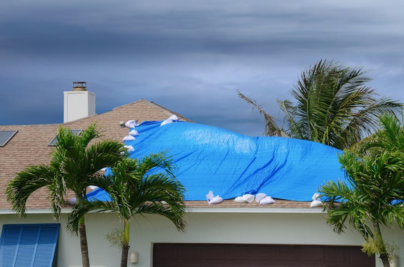 Tarp covering damaged roof