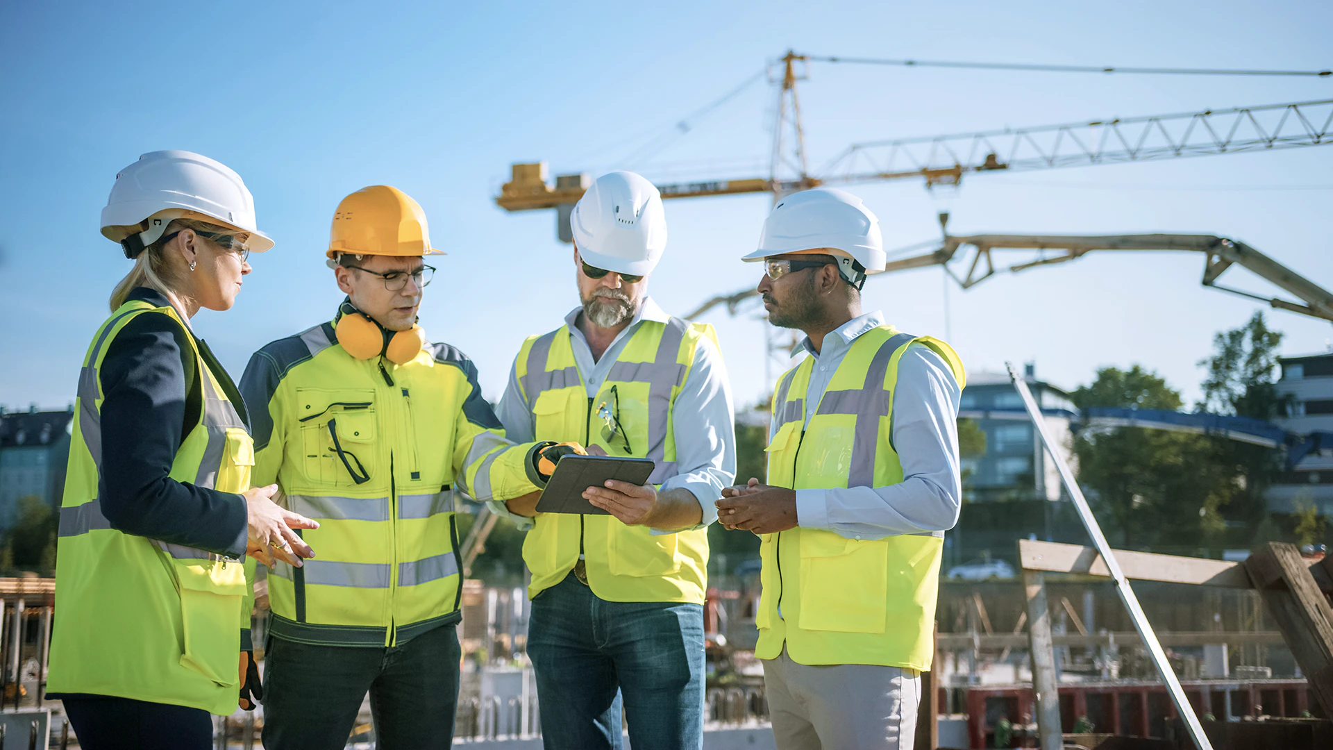 Image of construction workers on the field using a digital tablet to represent Gemini Quantities
