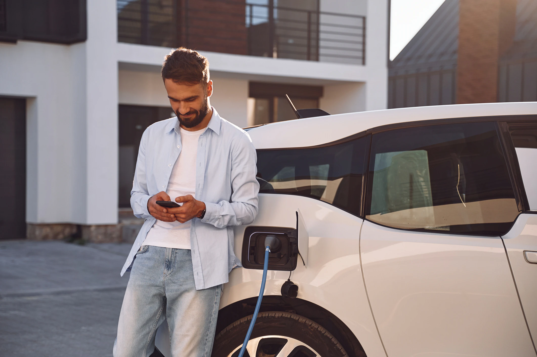 Man using app for smart EV charging