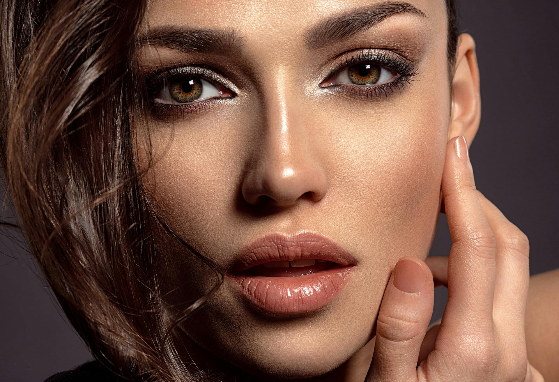 Woman with hand on her face