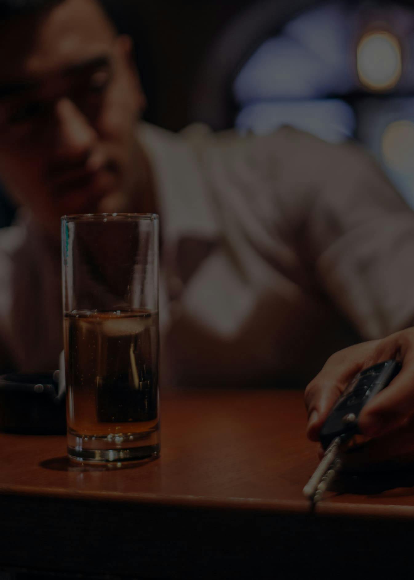 Man at a bar holding his car key