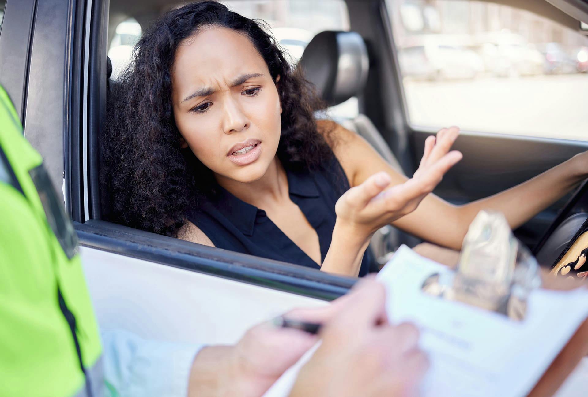 Woman upset at being pulled over and getting a ticket