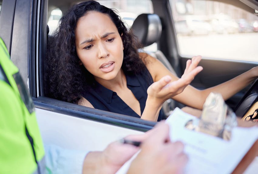 Woman upset at being pulled over and getting a ticket