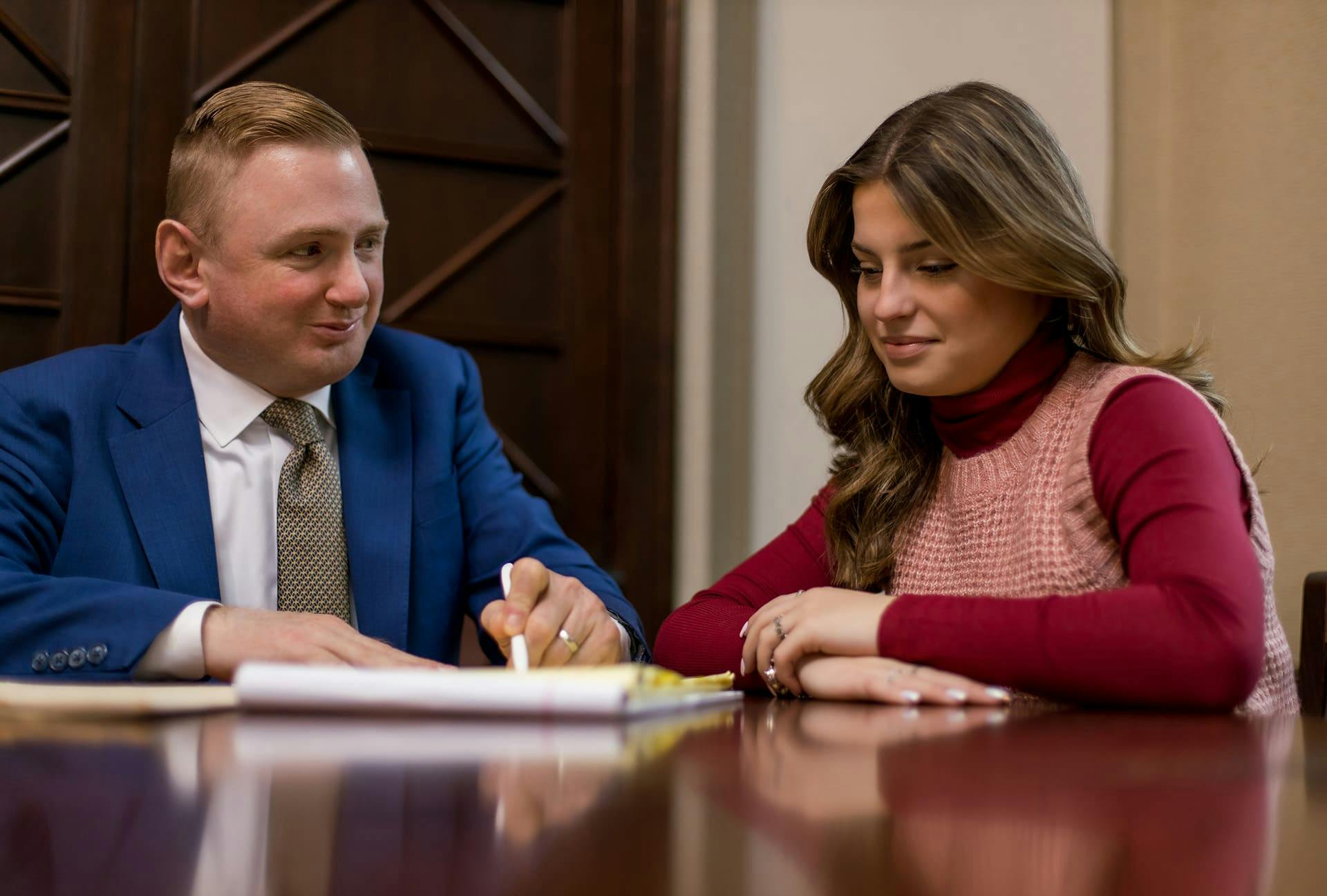 Matthew Gilman speaking with a client.