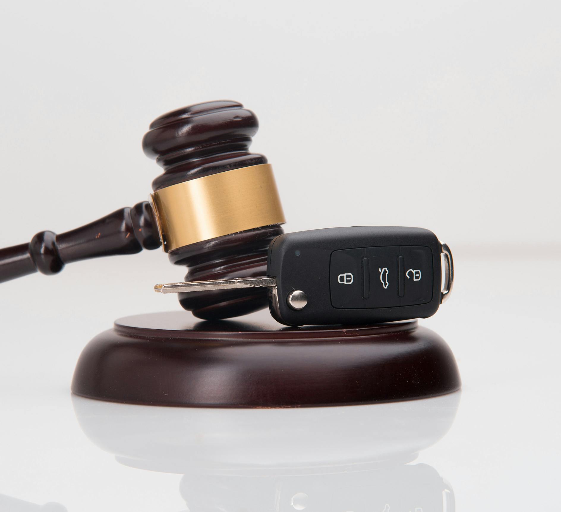 Gavel and block next to car keys