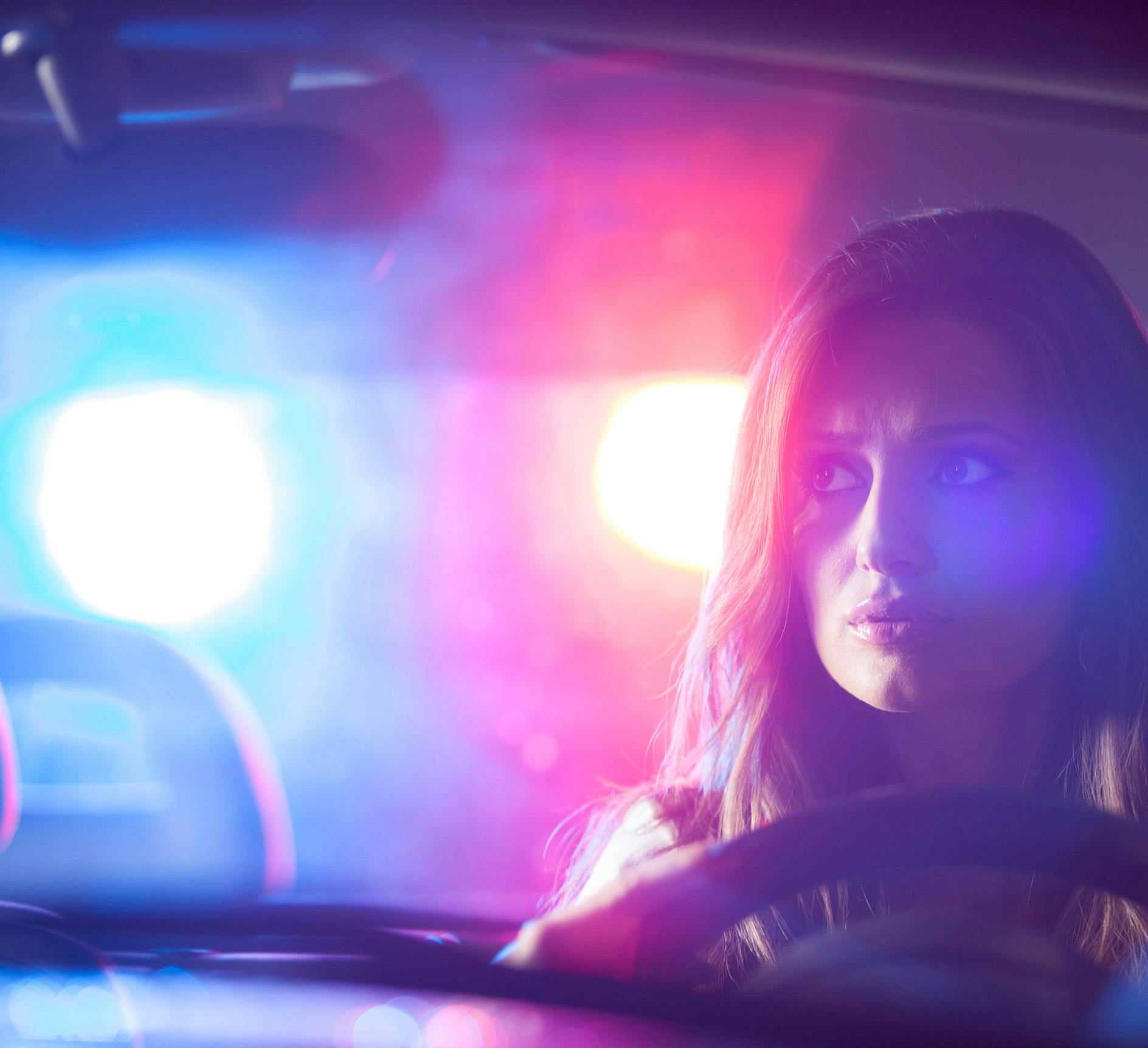 Woman being pulled over by a cop