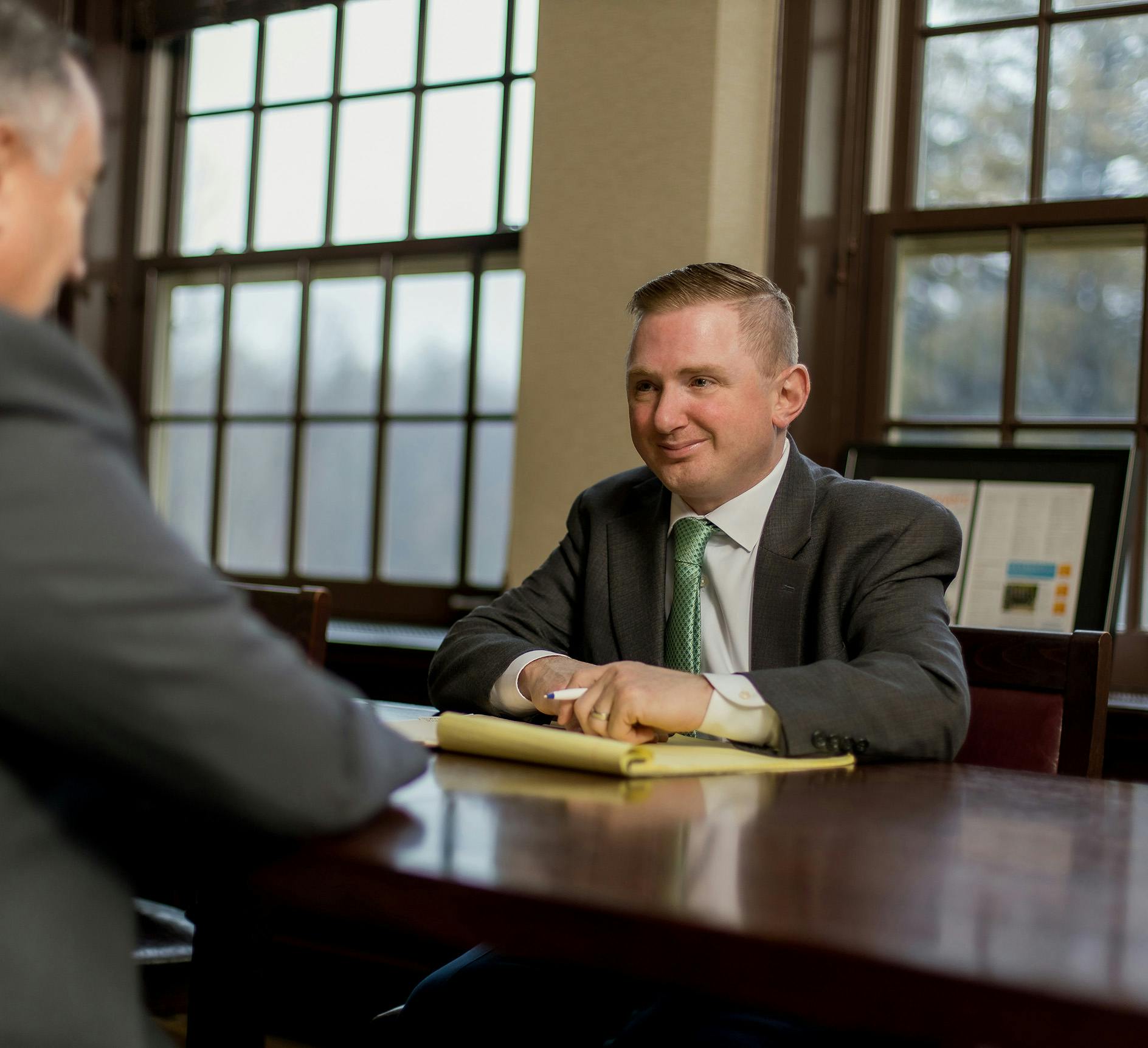 Matthew Gilman speaking to a client