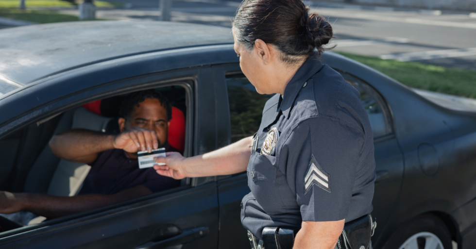 Police officer taking a persons license