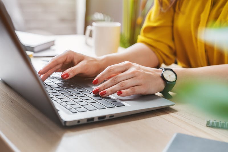 Woman typing on her computer