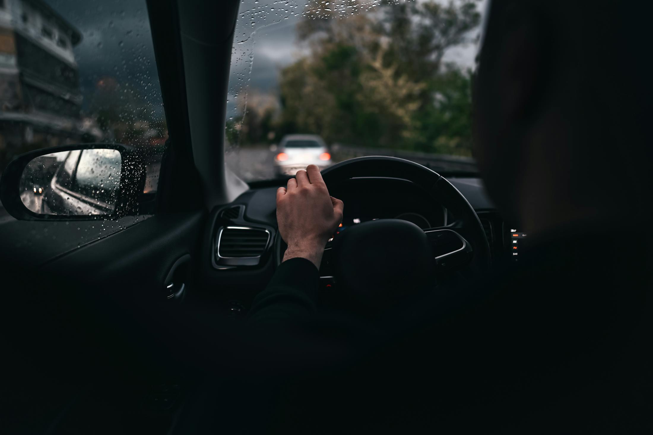 Woman Driving at night in the rain.