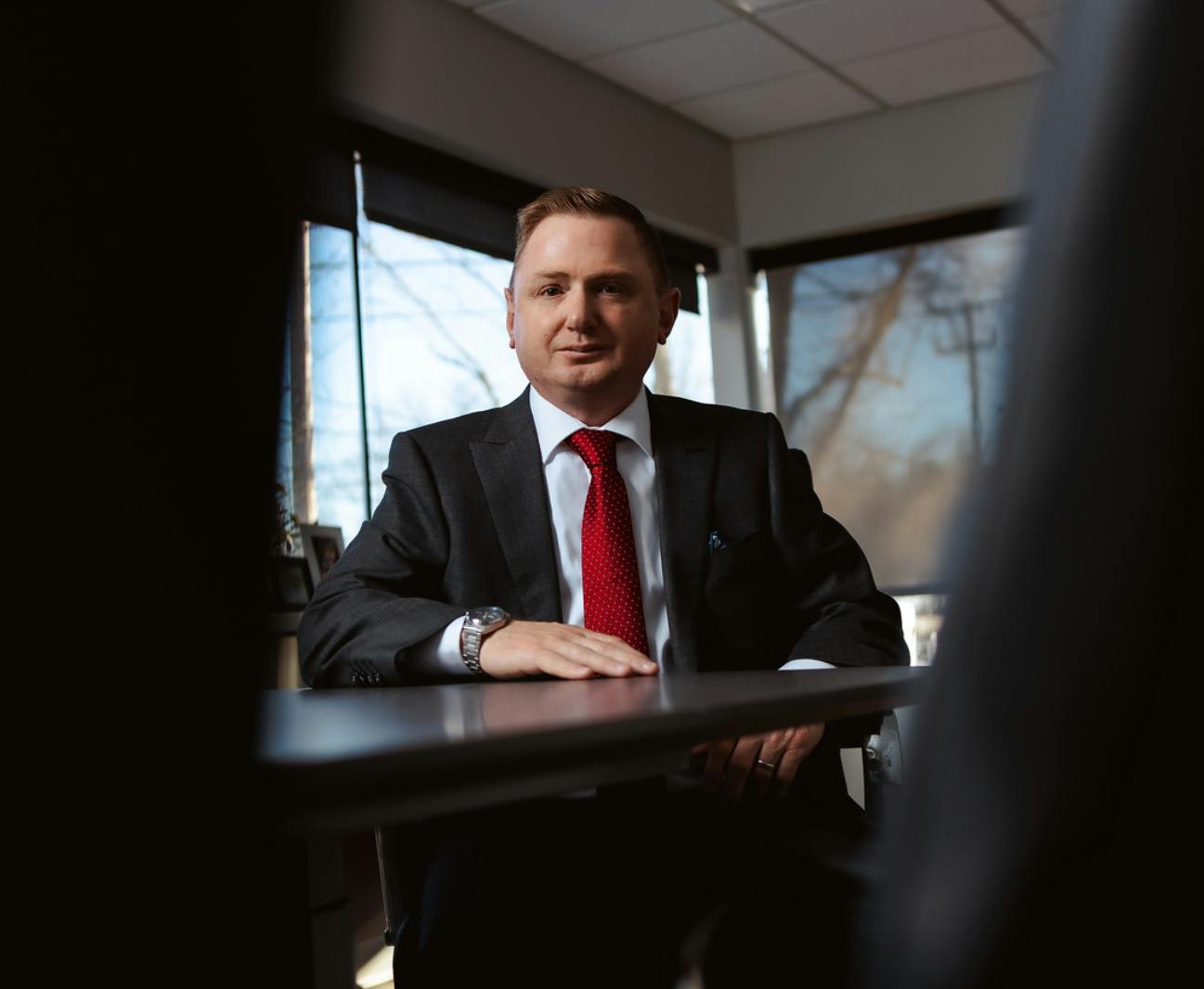 Matthew Gilman sitting at a desk